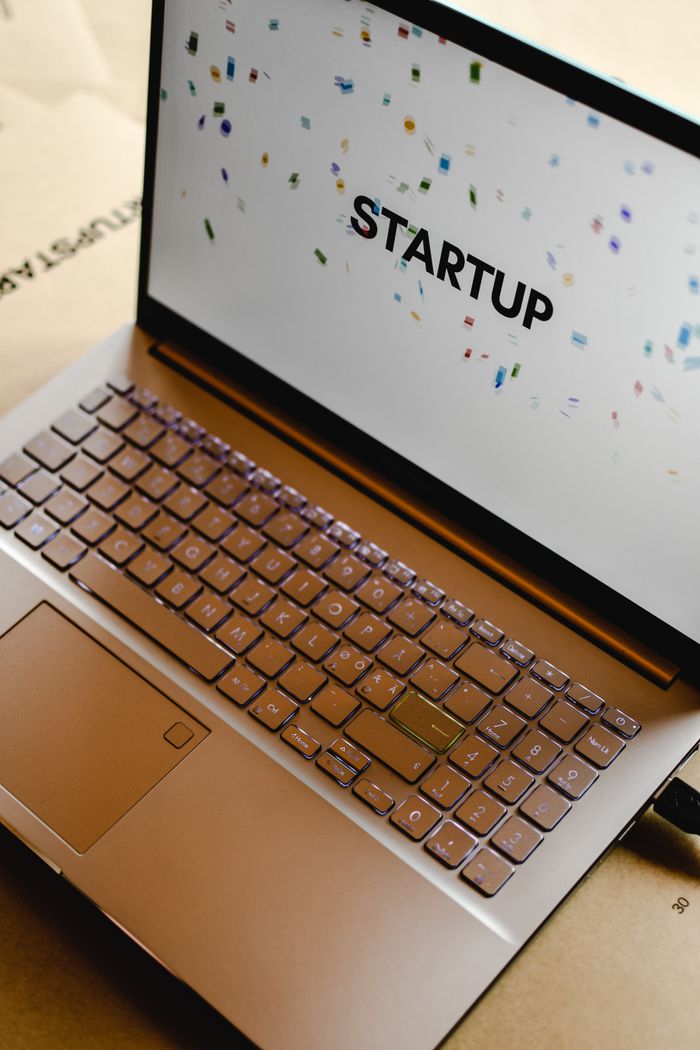 Close-up of a laptop screen displaying the word "STARTUP", ideal for business and tech themes.